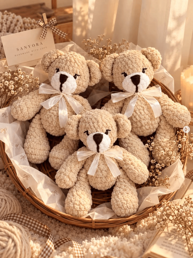 Honey-coloured crochet teddy bears in a gift basket